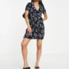 ASOS DESIGN Petite Plisse Short Sleeve Ruffle Wrap Mini Dress In Black And Blue Rose Print
